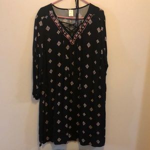 Black with pink and white patterned dress with matching belt.